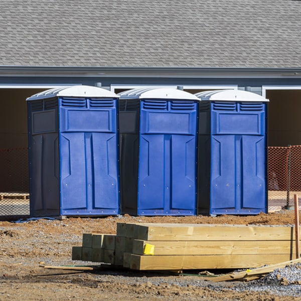 what is the cost difference between standard and deluxe porta potty rentals in Milan New Mexico